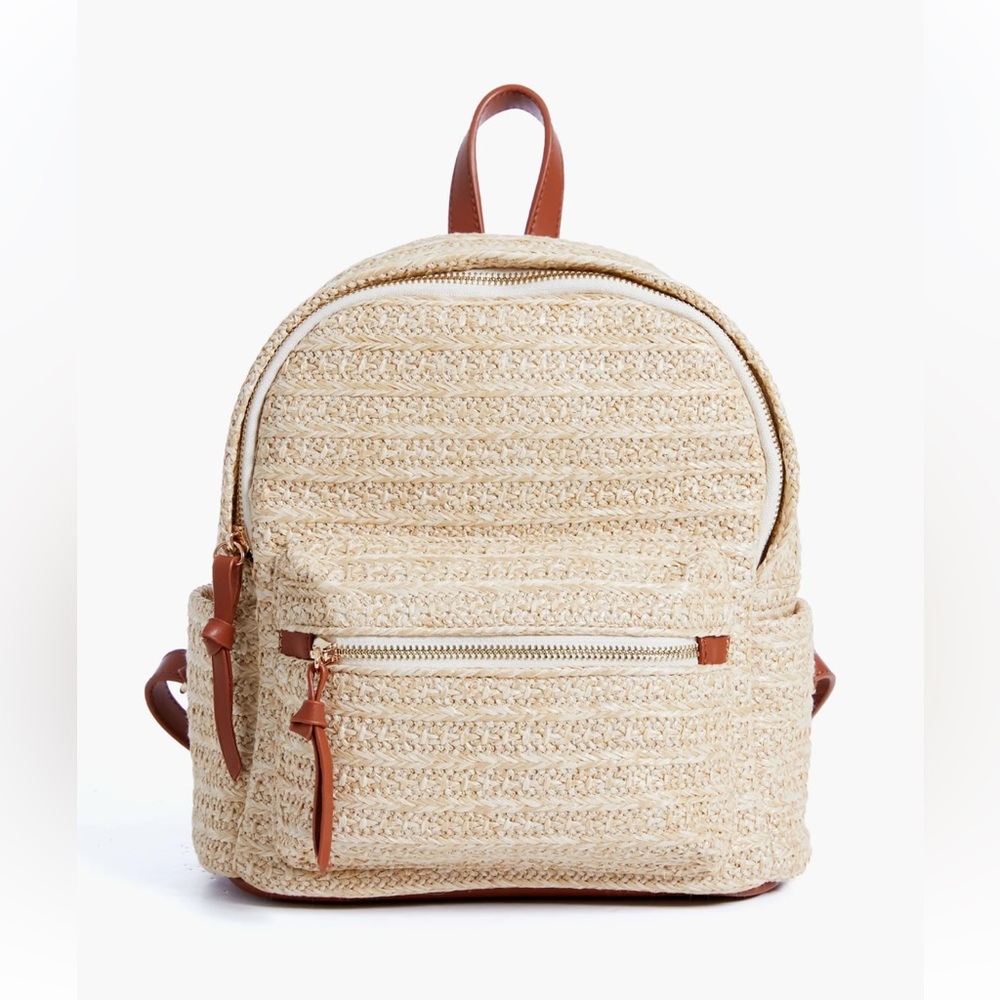 Tuckernuck Raffia Braided Backpack bag with leather details.